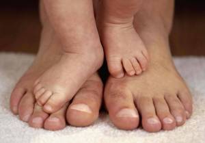 Feet of A Parent with Child